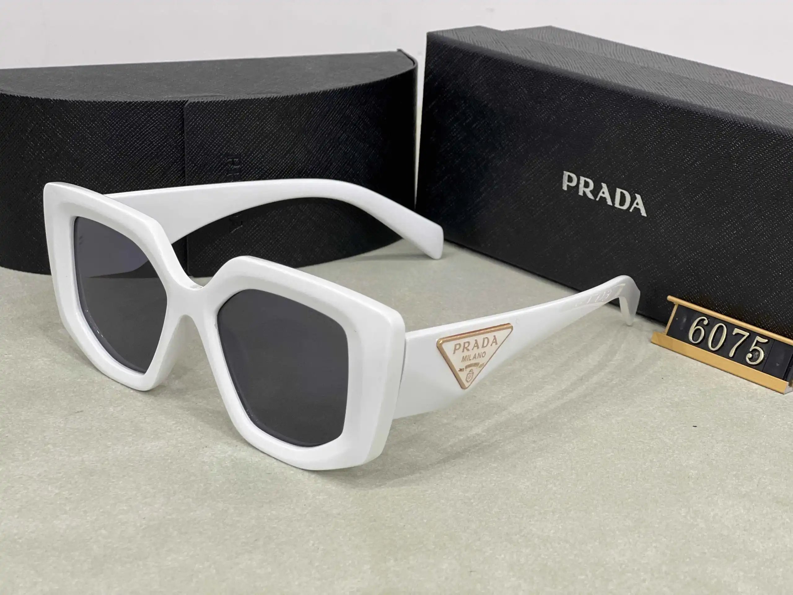 Prada Eyewear Assorted geometric-frame sunglasses with triangle logo plaques image 7