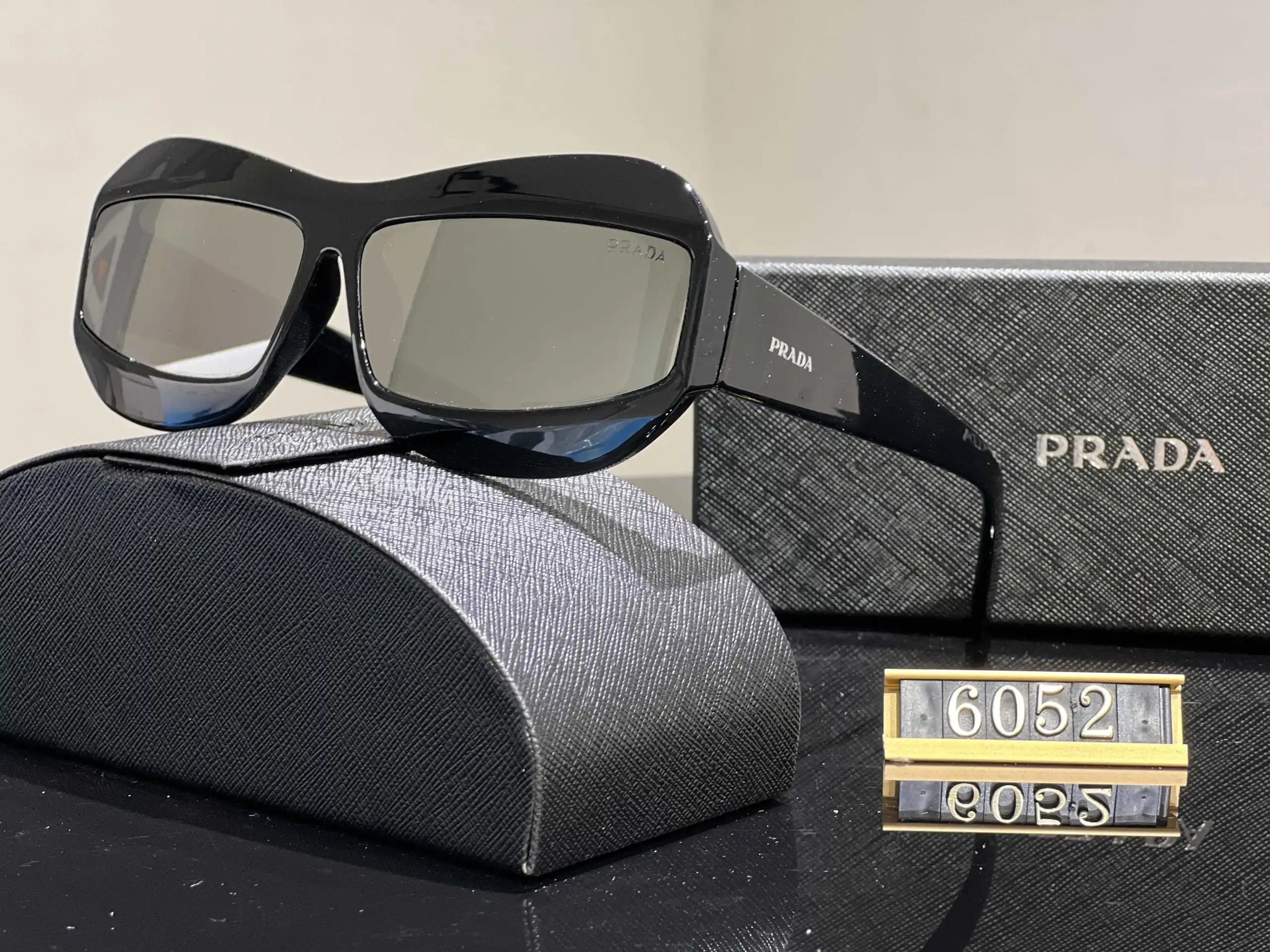 Prada Eyewear Assorted geometric-frame sunglasses with triangle logo plaques — 35