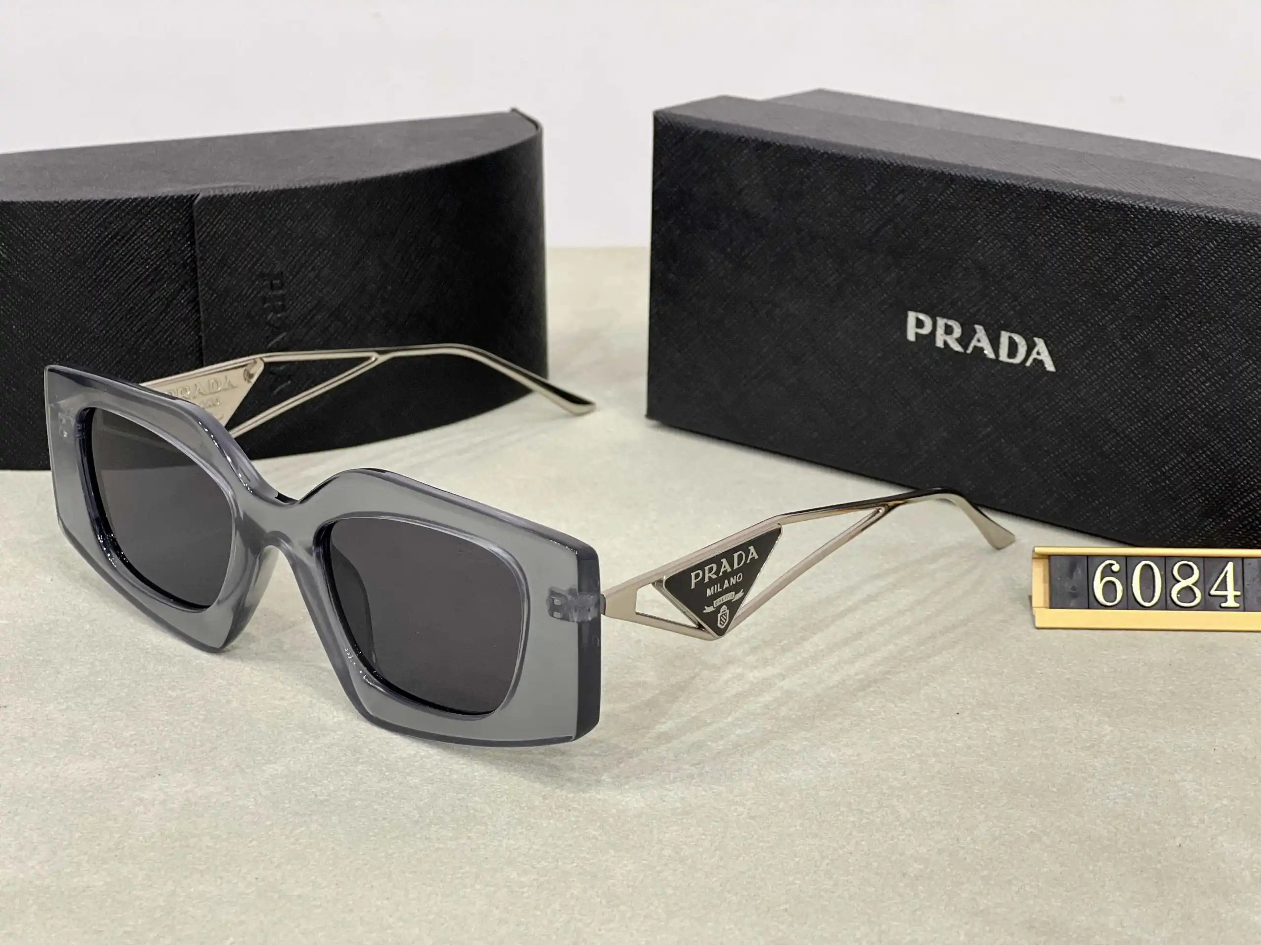 Prada Eyewear Assorted geometric-frame sunglasses with triangle logo plaques — 19