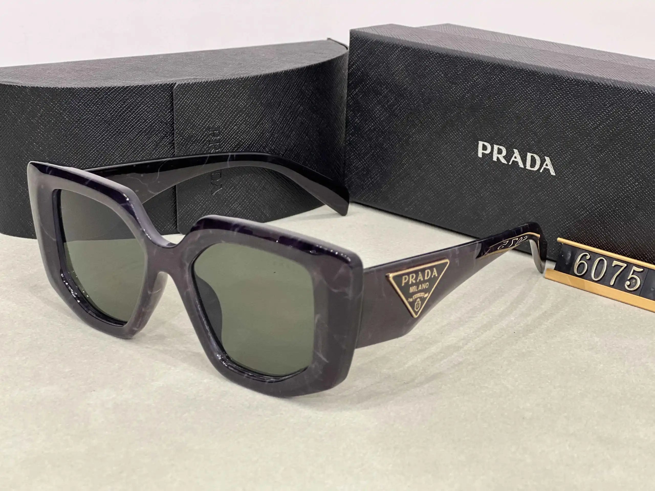 Prada Eyewear Assorted geometric-frame sunglasses with triangle logo plaques — 27