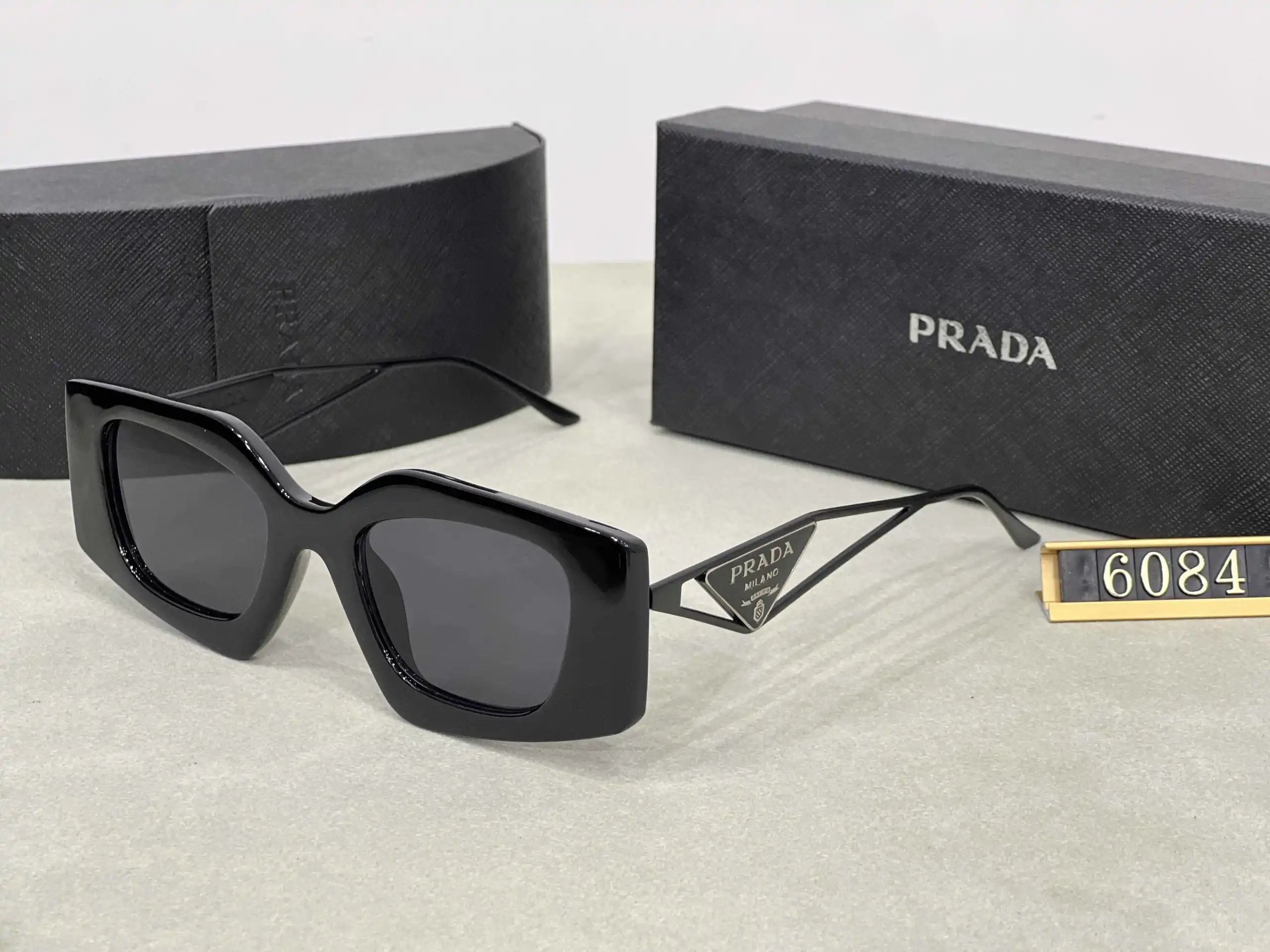 Prada Eyewear Assorted geometric-frame sunglasses with triangle logo plaques — 2