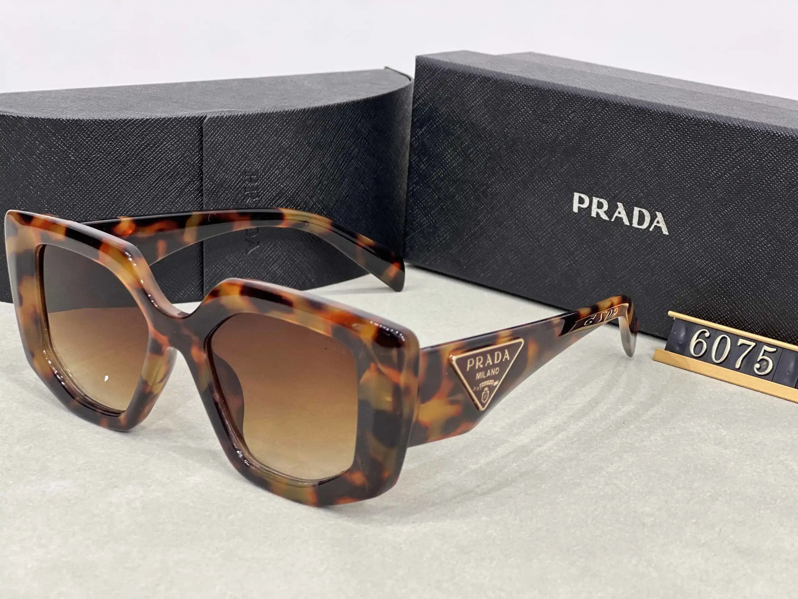 Prada Eyewear Assorted geometric-frame sunglasses with triangle logo plaques — 7