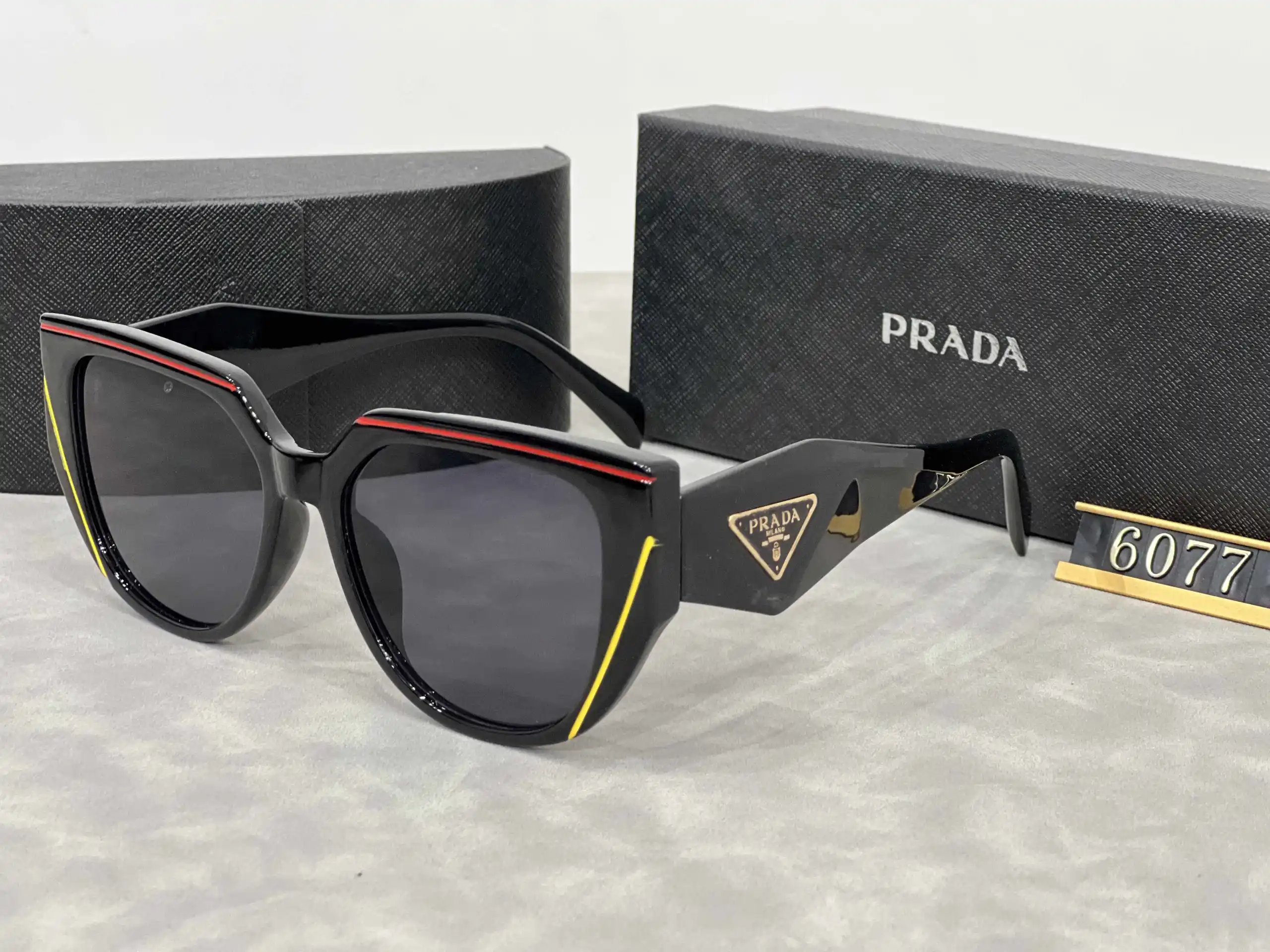 Prada Eyewear Assorted geometric-frame sunglasses with triangle logo plaques — 23