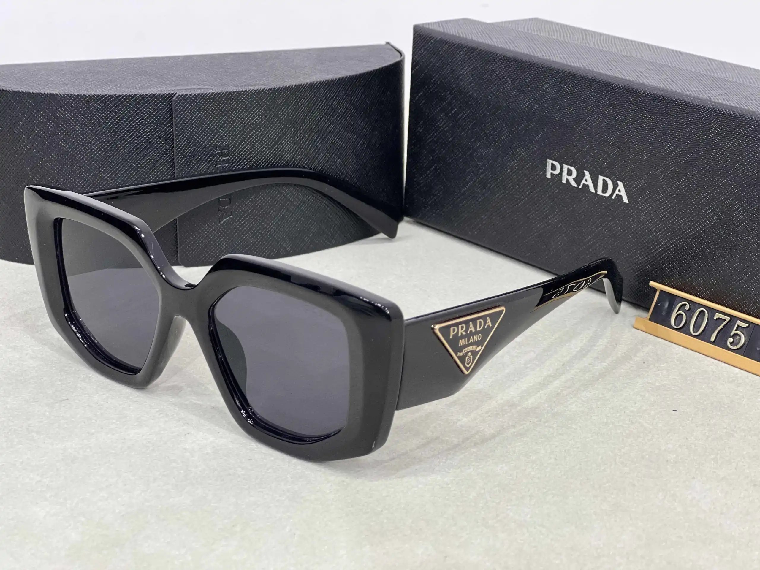 Prada Eyewear Assorted geometric-frame sunglasses with triangle logo plaques — 28