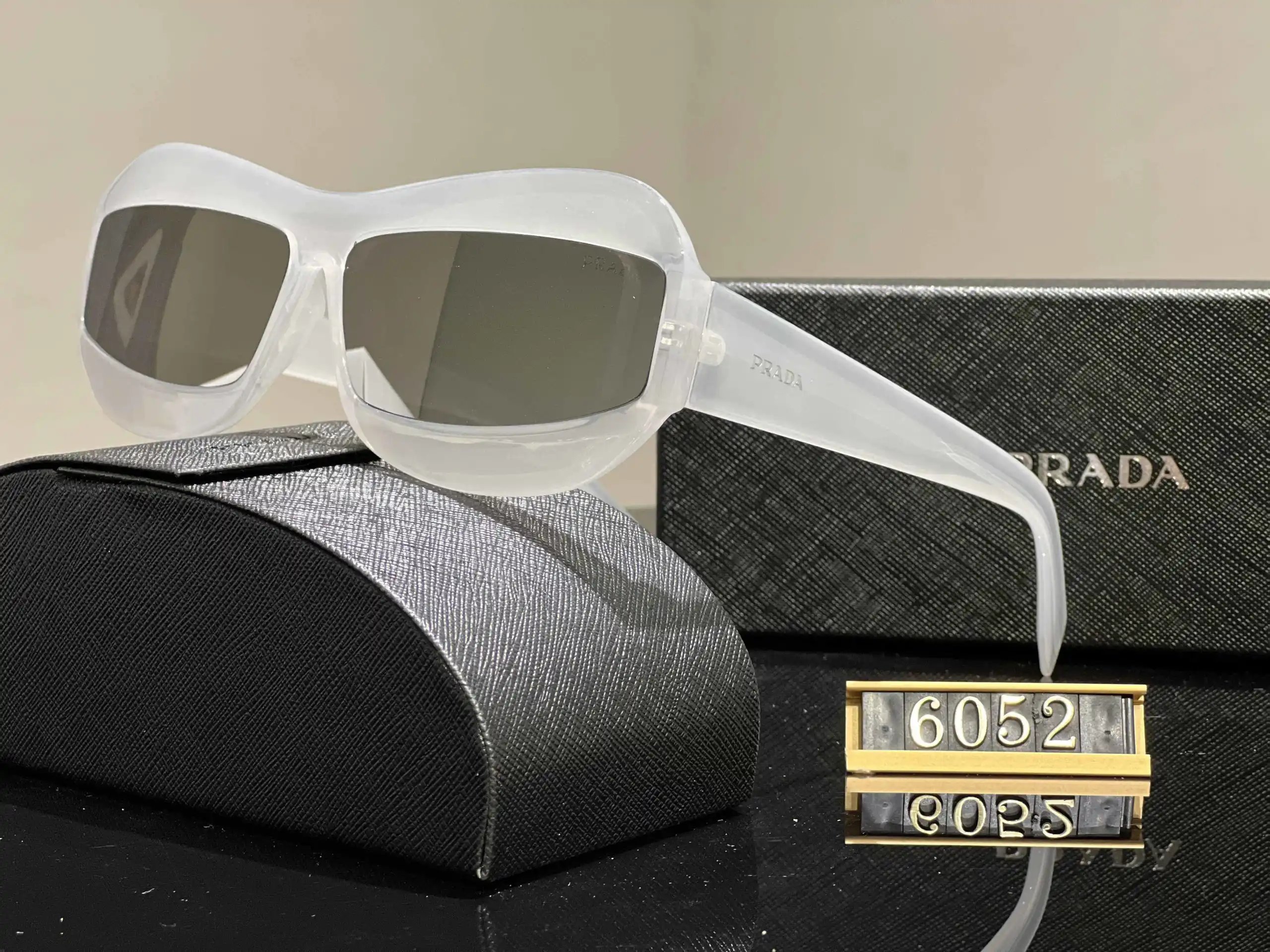 Prada Eyewear Assorted geometric-frame sunglasses with triangle logo plaques — 11