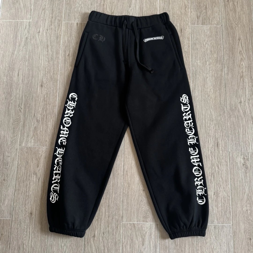 Black sweatpants with Sanskrit letters on the side