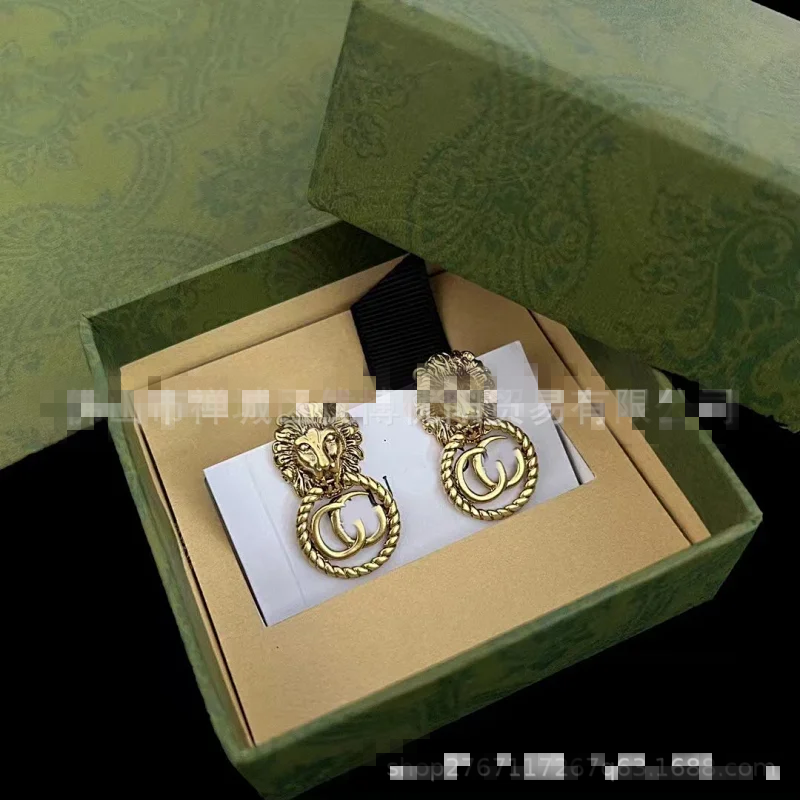 Gucci Gold Lion Head Double G Vintage Clip Earrings