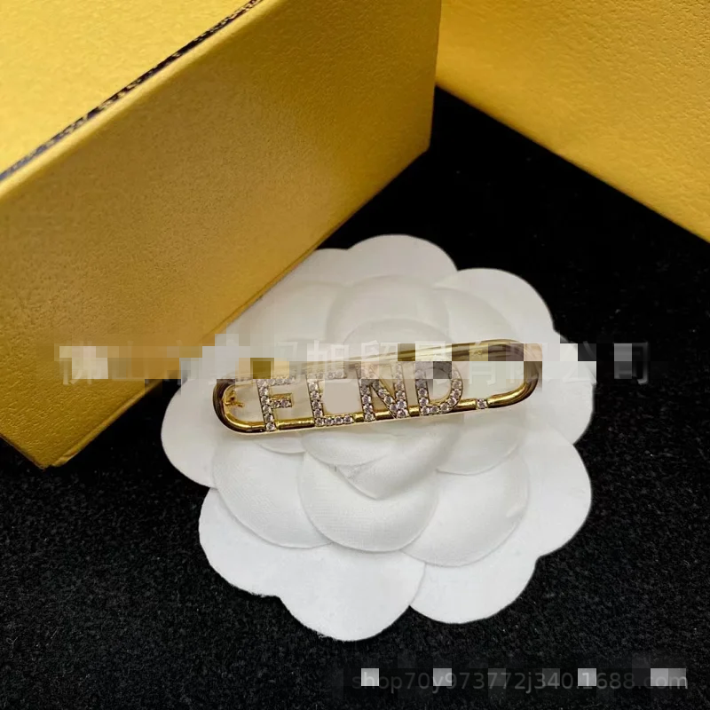 FENDI brooch