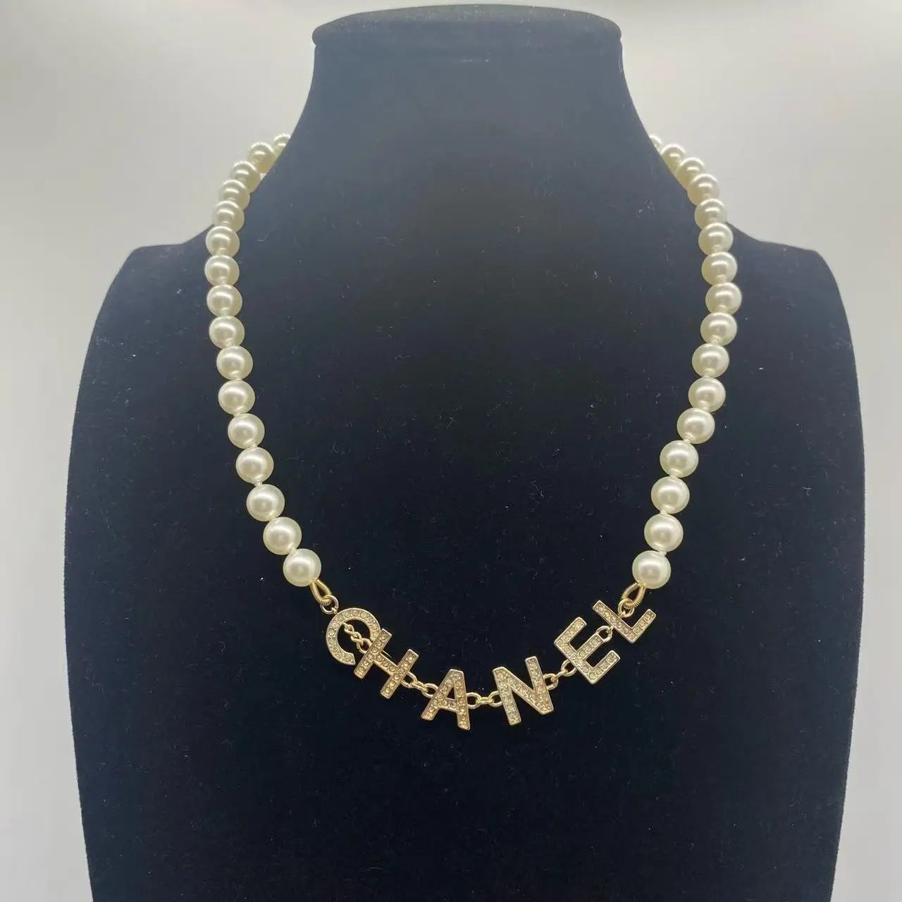 Chanel Jewelry Logo Pendant Necklace — 32