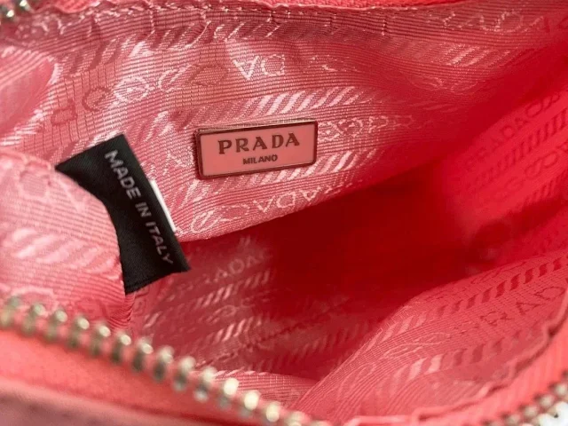 Prada Crossbody Bags Re-Edition 2000 nylon bag with detachable pouch, chain strap, and adjustable webbing strap product detail image 6