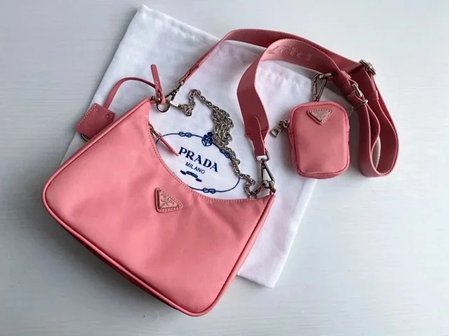 Prada Crossbody Bags Re-Edition 2000 nylon bag with detachable pouch, chain strap, and adjustable webbing strap product detail image 2