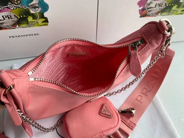 Prada Crossbody Bags Re-Edition 2000 nylon bag with detachable pouch, chain strap, and adjustable webbing strap product detail image 9