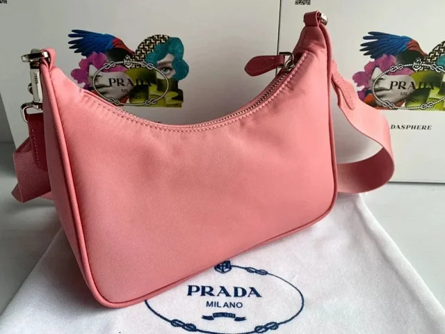 Prada Crossbody Bags Re-Edition 2000 nylon bag with detachable pouch, chain strap, and adjustable webbing strap product detail image 4
