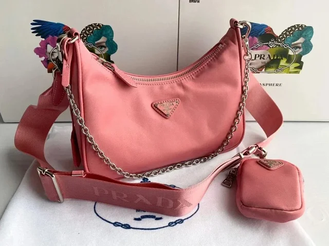 Prada Crossbody Bags Re-Edition 2000 nylon bag with detachable pouch, chain strap, and adjustable webbing strap product detail image 10