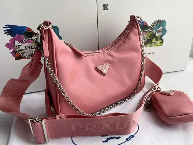 Prada Crossbody Bags Re-Edition 2000 nylon bag with detachable pouch, chain strap, and adjustable webbing strap product detail image 3