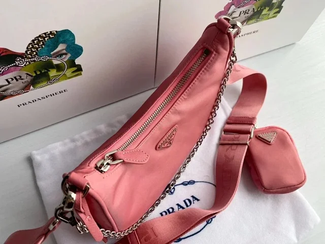 Prada Crossbody Bags Re-Edition 2000 nylon bag with detachable pouch, chain strap, and adjustable webbing strap product detail image 11