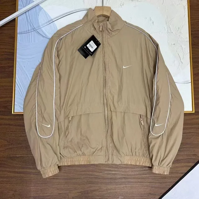 Nike Mixed apparel variants including trousers, quarter-zip tops, and a hooded puffer jacket product detail image 10