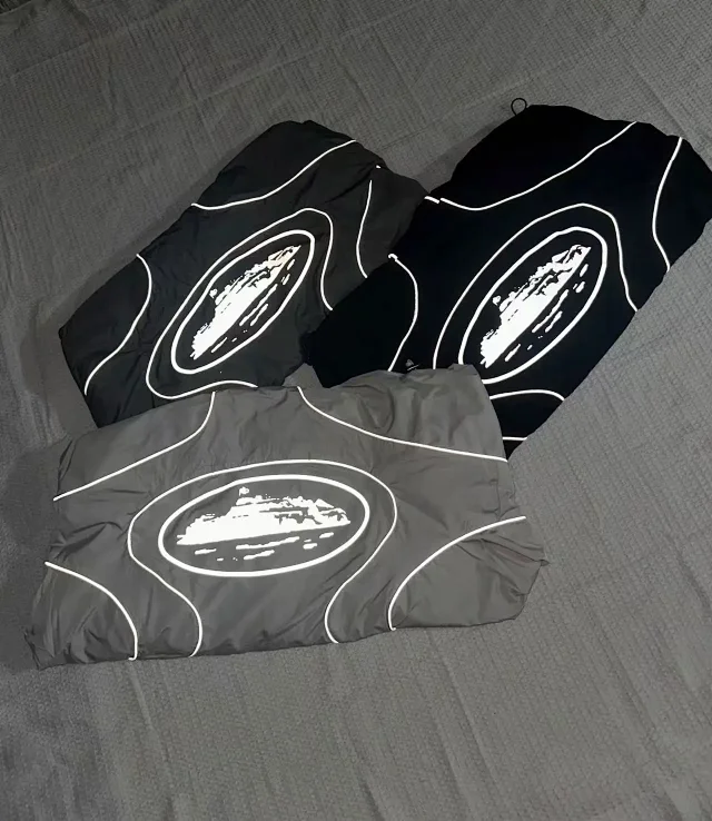 Nike Mixed apparel variants including trousers, quarter-zip tops, and a hooded puffer jacket product detail image 21