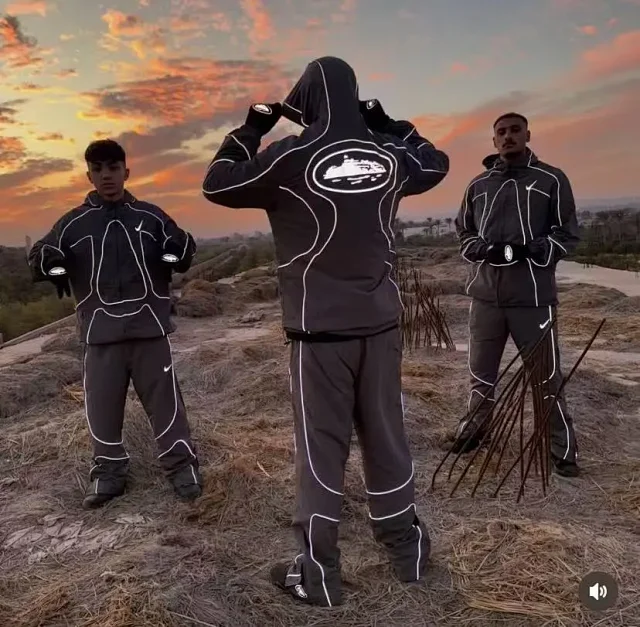 Nike Mixed apparel variants including trousers, quarter-zip tops, and a hooded puffer jacket product detail image 25