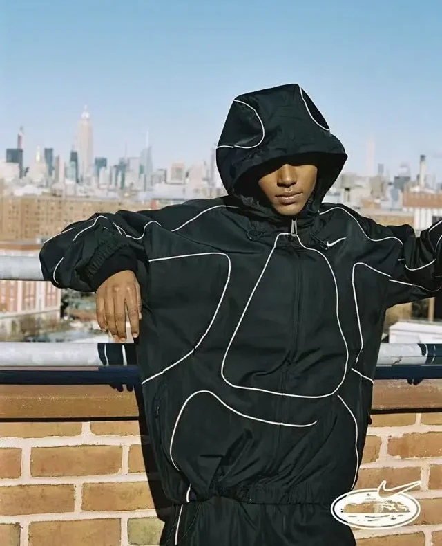 Nike Mixed apparel variants including trousers, quarter-zip tops, and a hooded puffer jacket product detail image 28