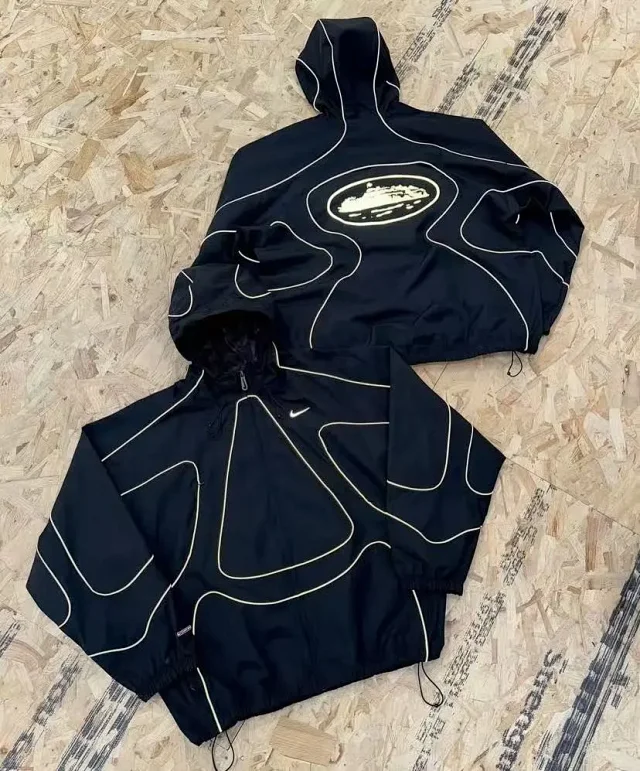 Nike Mixed apparel variants including trousers, quarter-zip tops, and a hooded puffer jacket product detail image 20