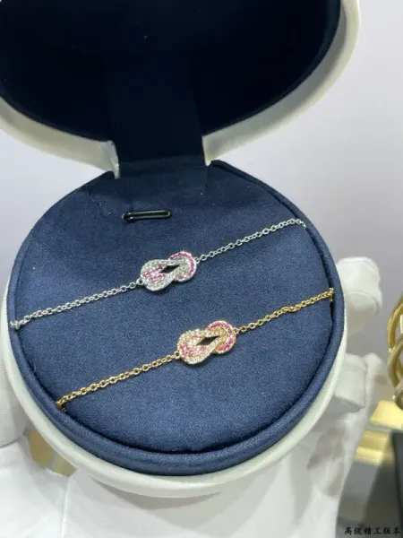 Design Infinity Knot Bracelet in Rose Gold and Silver with Pink Sapphire and Diamond Accents Jewelry - 1