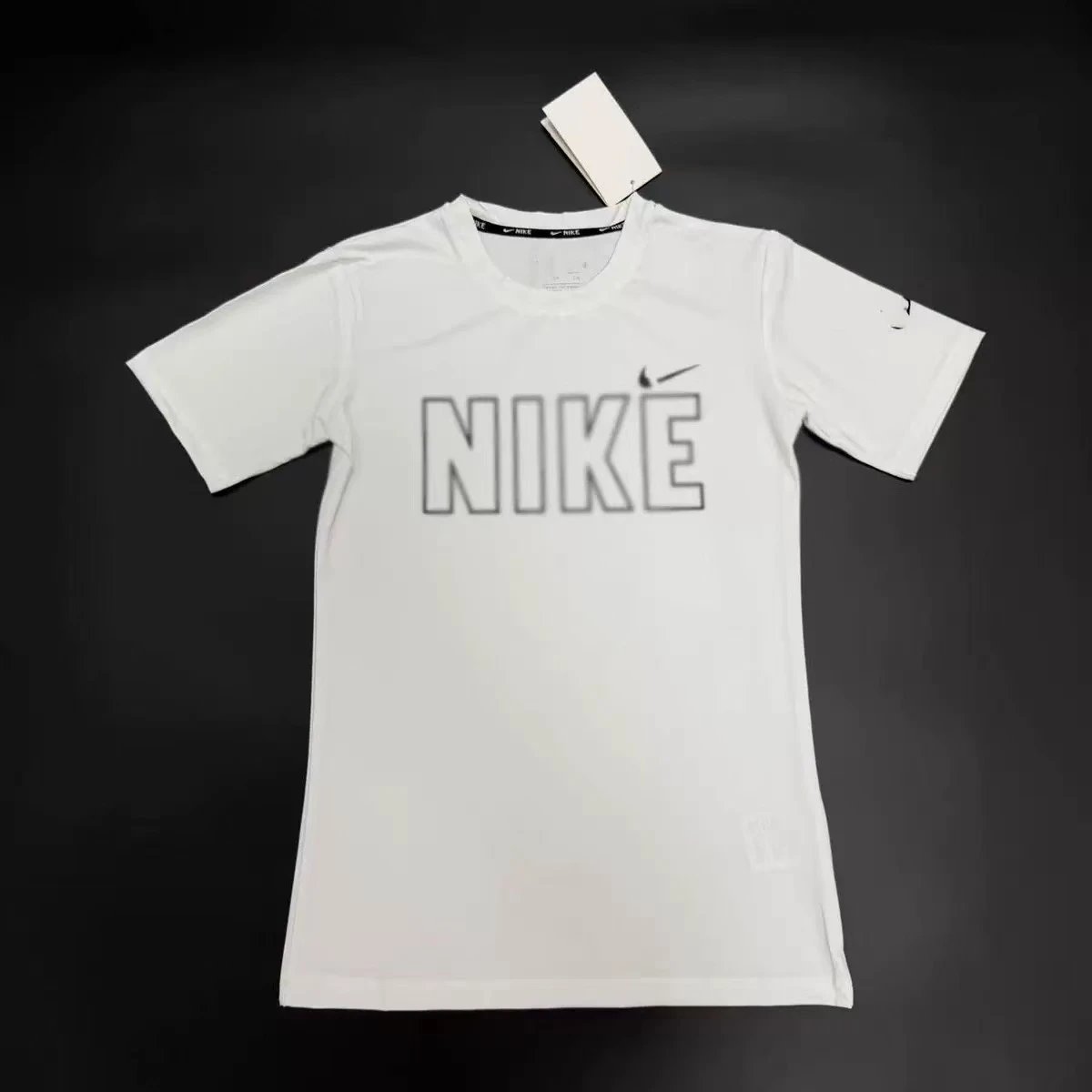 Nike T-Shirts Performance training T-shirt with contrast flatlock seams and oversized Swoosh — 12.