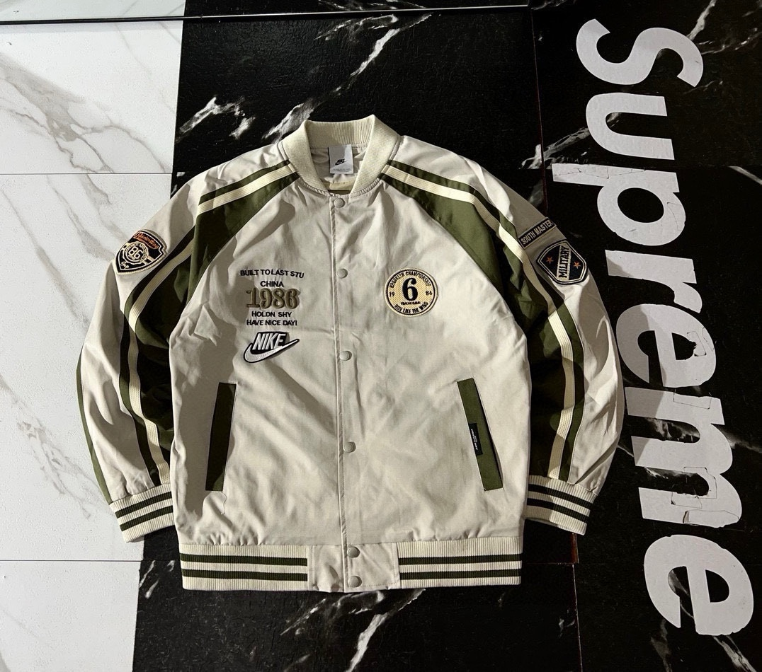 Nike Jackets Varsity-style snap-front jacket with contrast striped sleeves and patches — 02