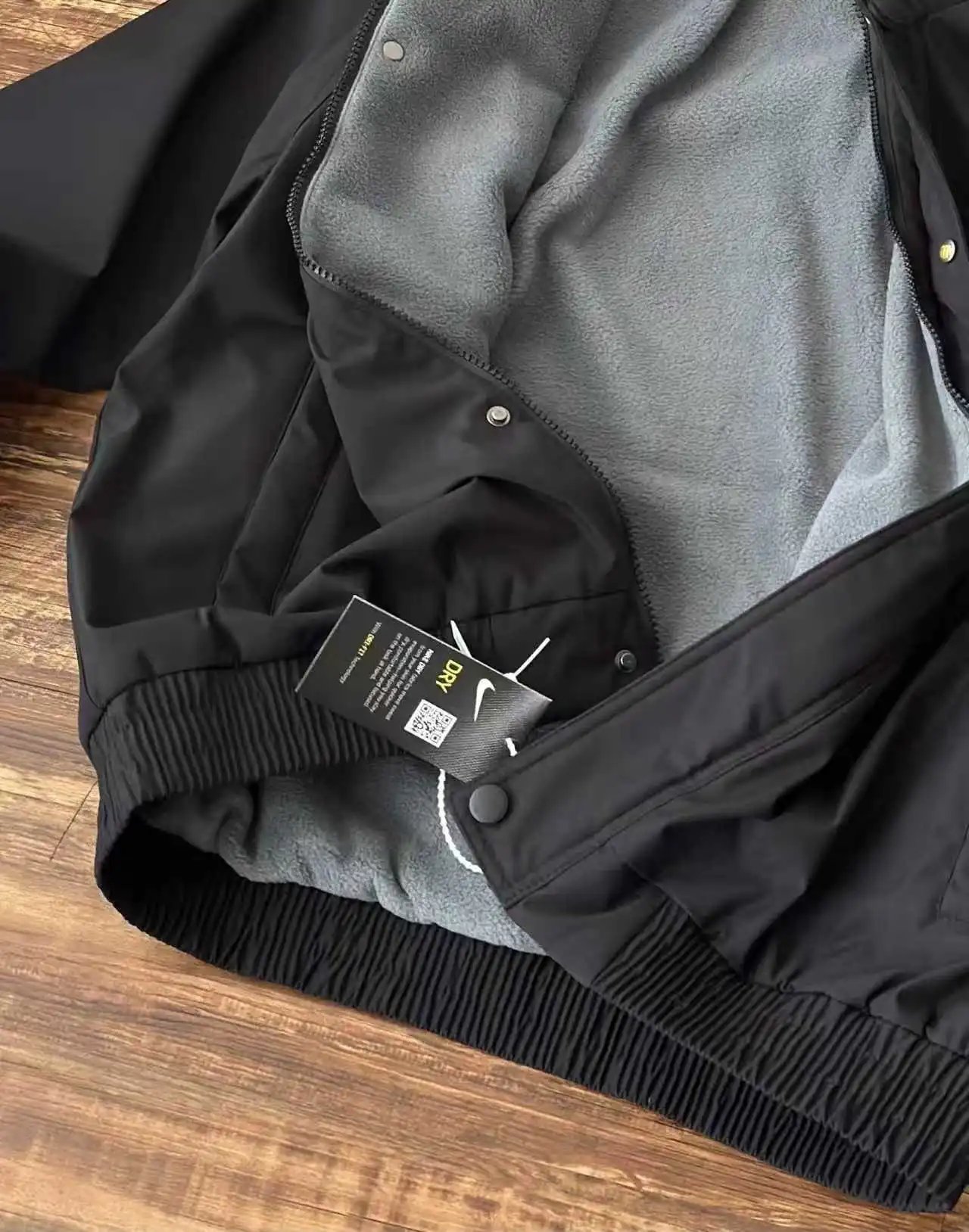 Nike Jackets Varsity-style snap-front jacket with contrast striped sleeves and patches image 11