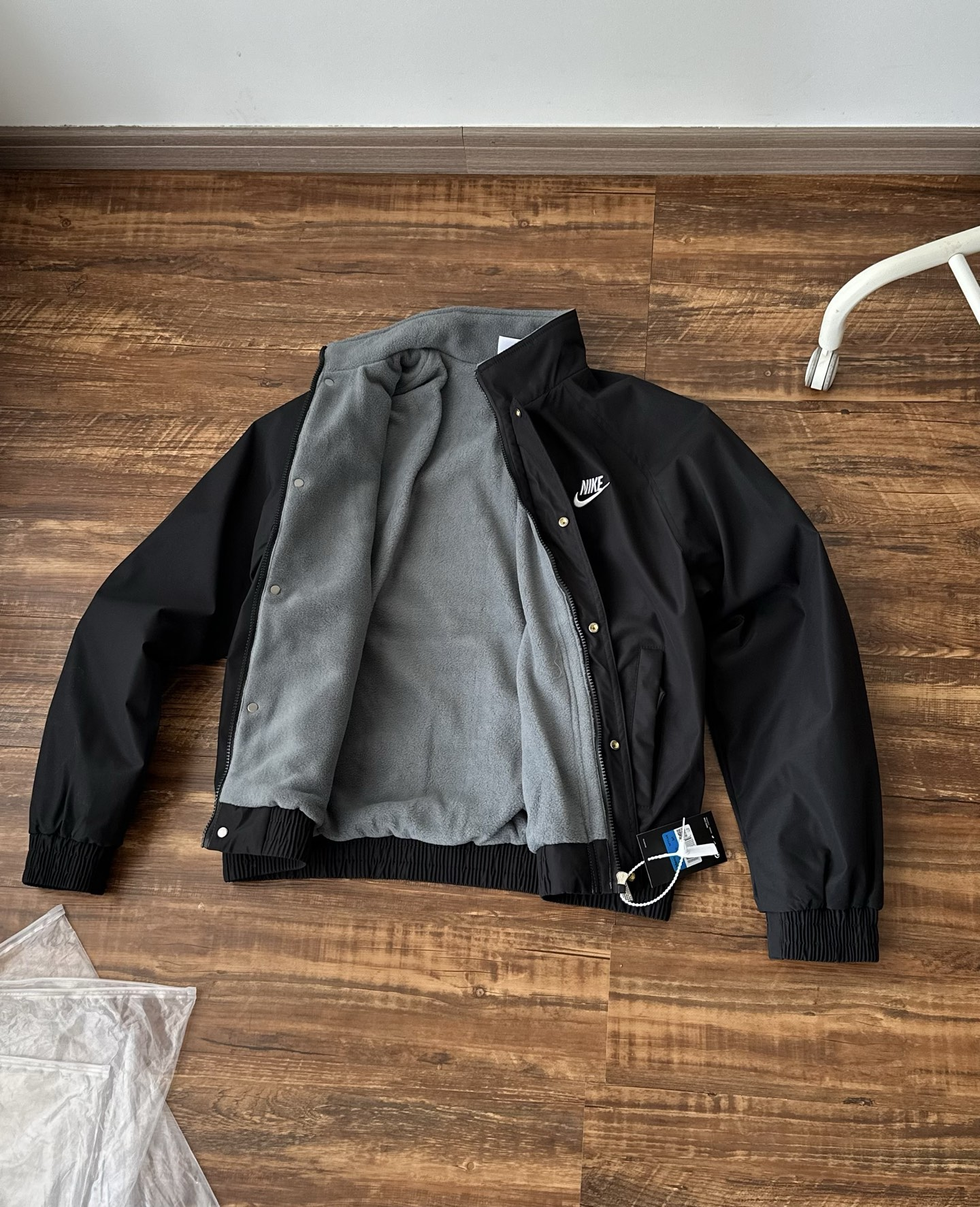 Nike Jackets Varsity-style snap-front jacket with contrast striped sleeves and patches — 18