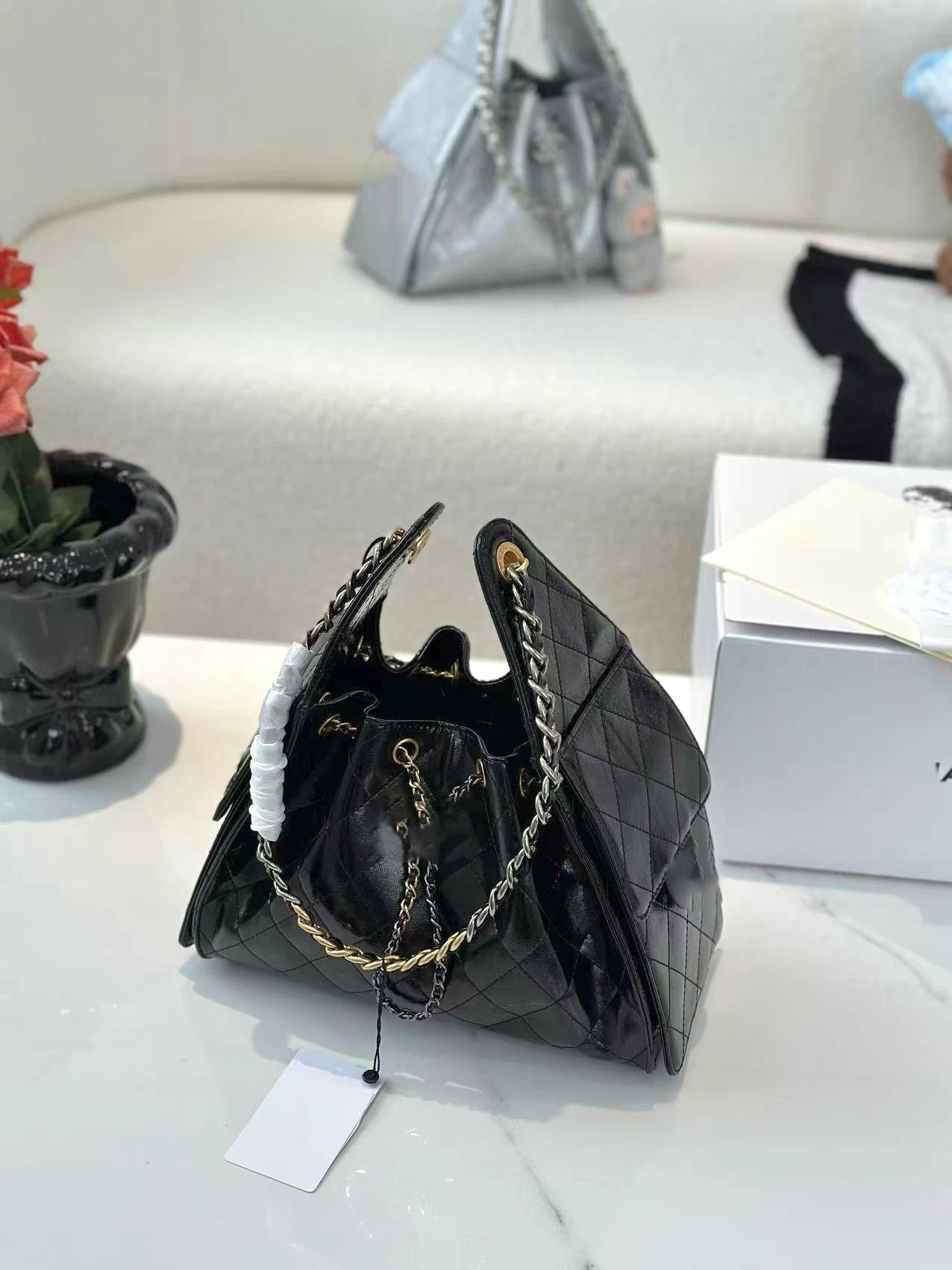 Chanel Shoulder Bags 25 drawstring chain bag — Black oilskin gold buckle