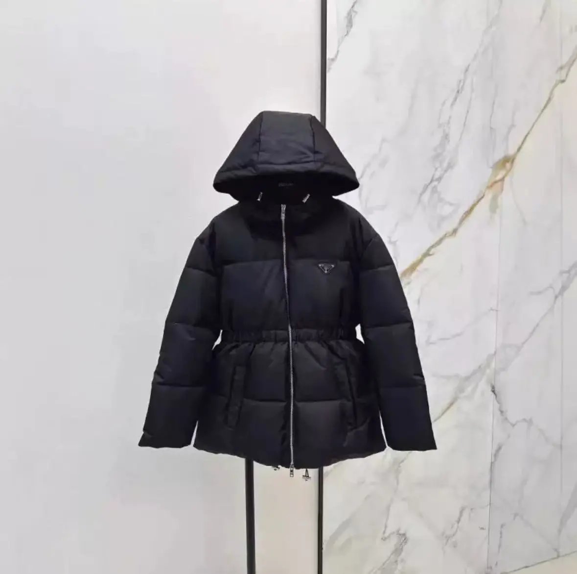 Prada Down Jackets Hooded and stand-collar puffer designs with triangular logo plaque — Hooded Waist Down Jacket Bee Small Black