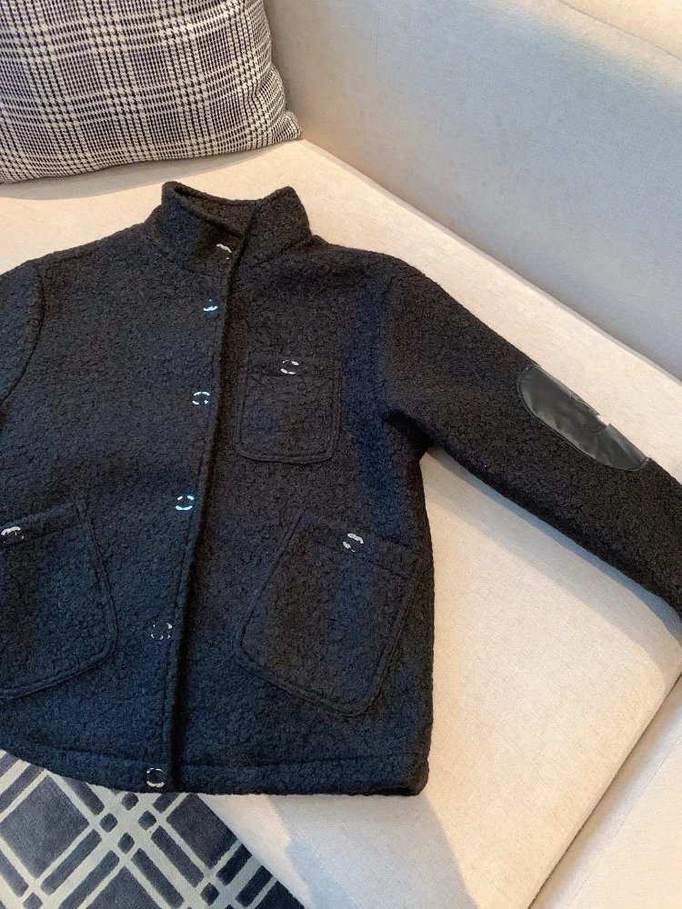 Chanel Jackets Bouclé stand-collar jacket with patch pockets and quilted elbow patches — Black