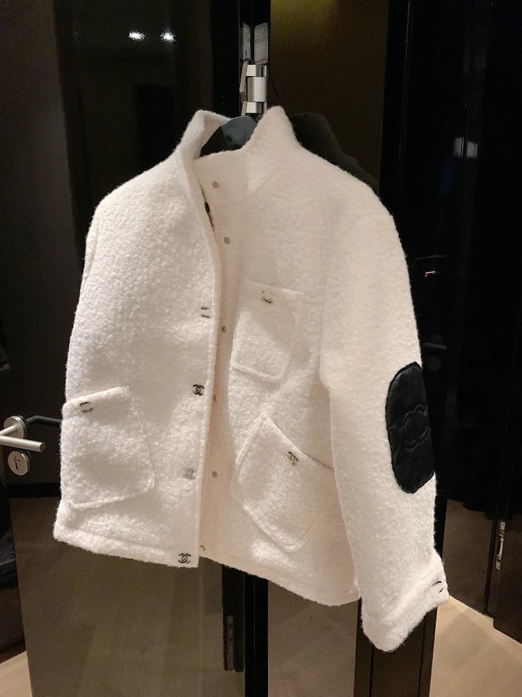 Chanel Jackets Bouclé stand-collar jacket with patch pockets and quilted elbow patches — white
