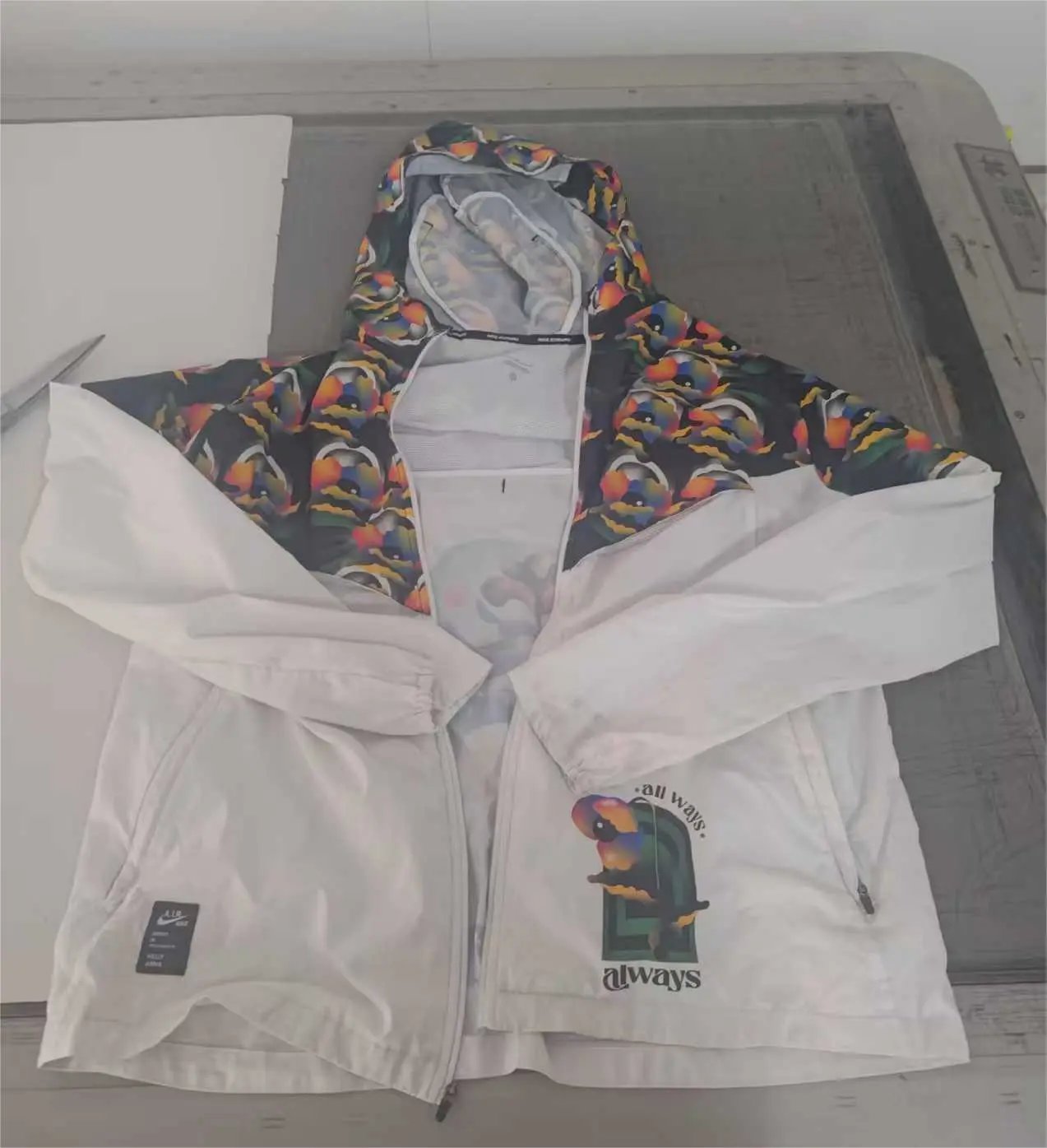 Nike Jackets Hooded graphic windbreaker jacket — AA2