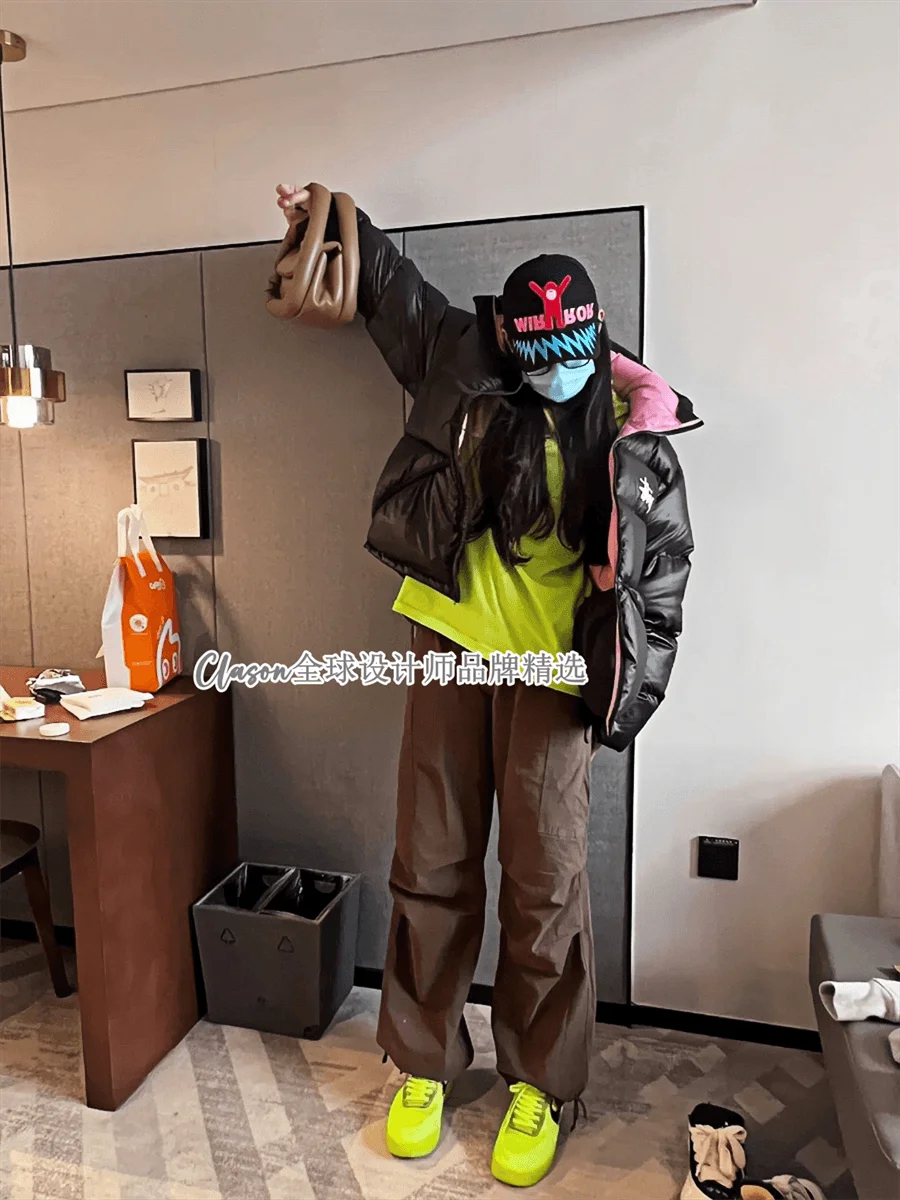 Black Puffer Jacket with Brown Pants and Neon Green Shoes