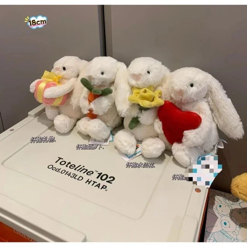 Rabbit plush toy holding birthday cake