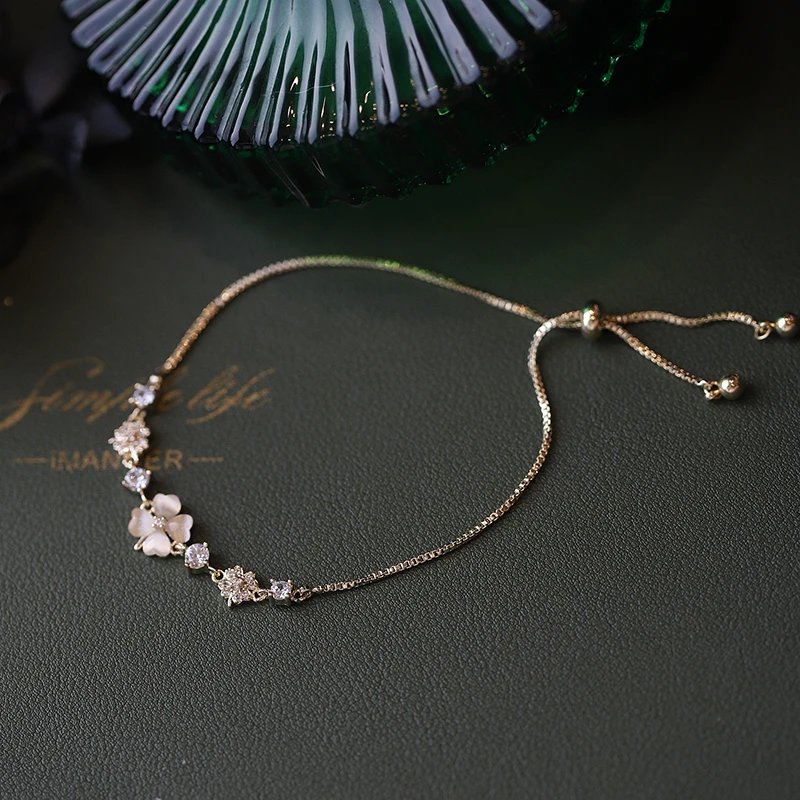 Gold Tone Floral Charm White Shell Adjustable Bracelet