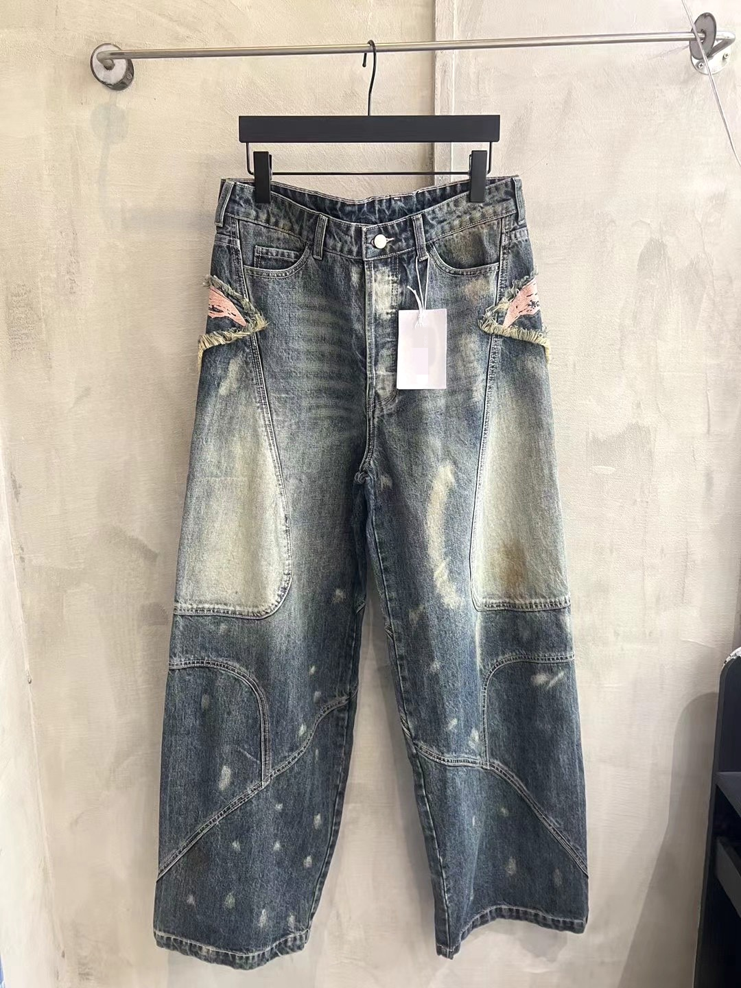 AC-style embroidered distressed splatter paint jeans