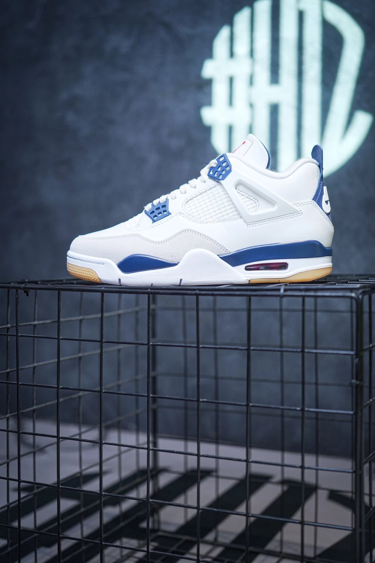 NK SB x Air Jordan 4 'Navy' collaboration in white and blue.