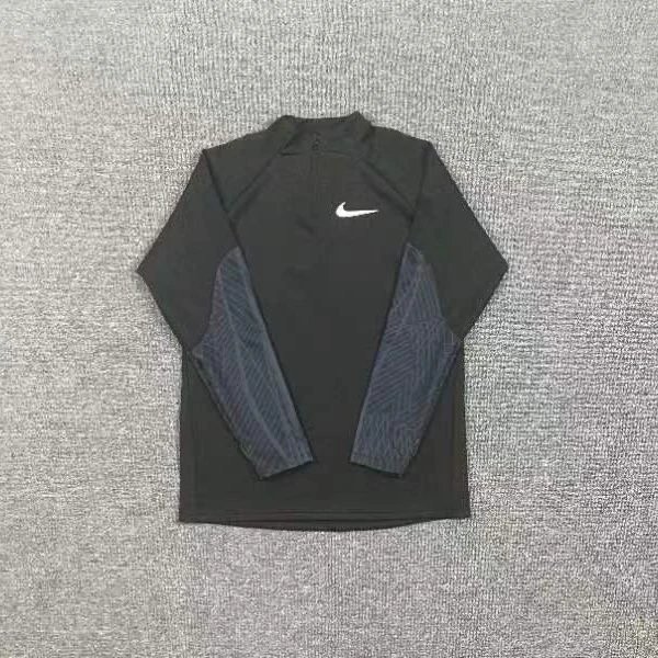 Nike Trousers Tapered athletic track pants — Black half-zip long-sleeve