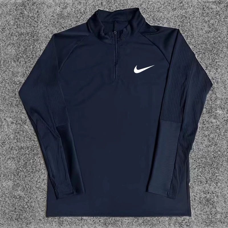 Nike Trousers Tapered athletic track pants — Black ribbed half-zip long-sleeve