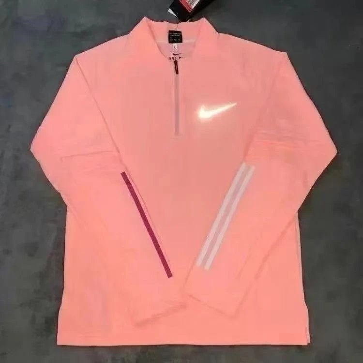 Nike Trousers Tapered athletic track pants — Orange half-zip long-sleeve