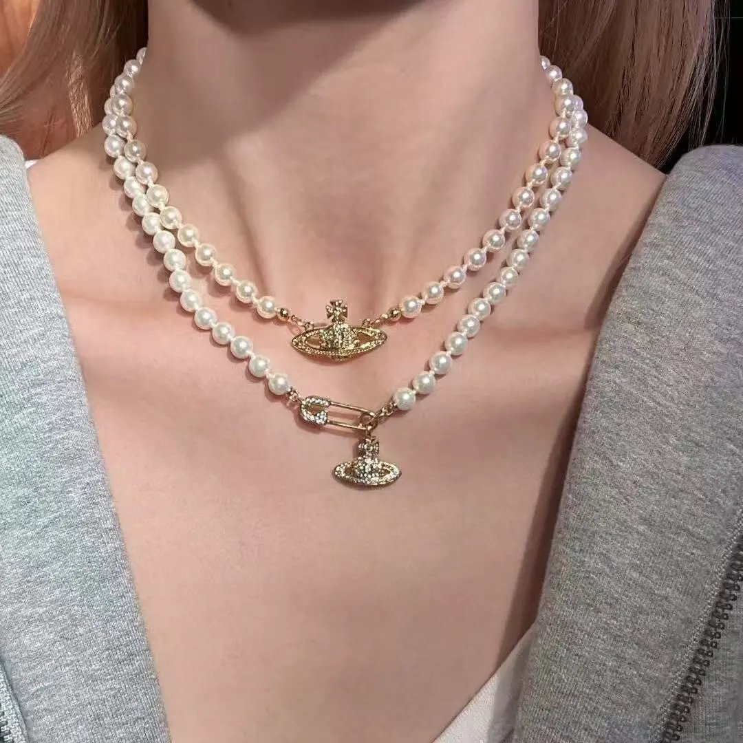 Vivienne Westwood Jewelry Crystal Orb Safety Pin Necklace — 33