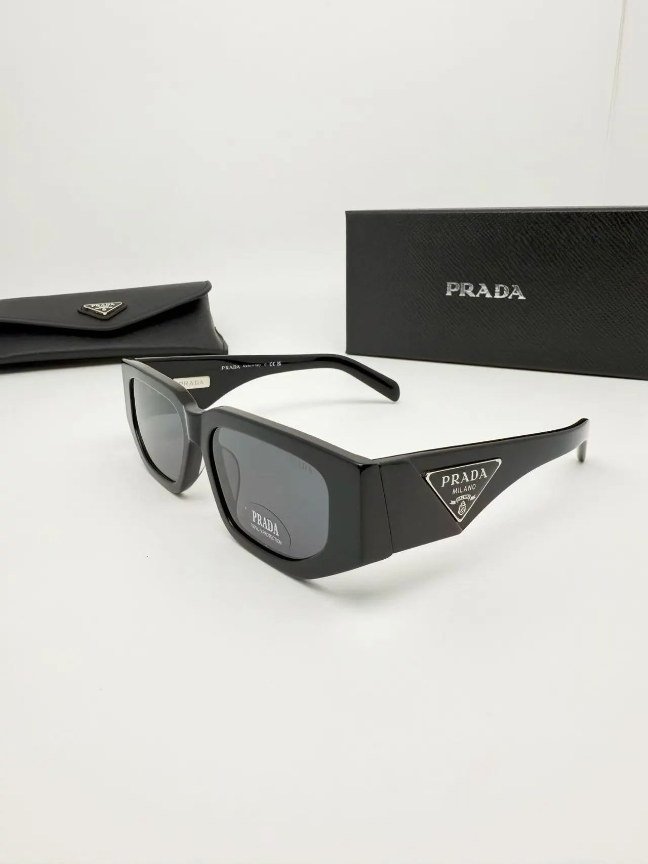 Prada Eyewear Square-frame sunglasses with triangle-logo temples — 1