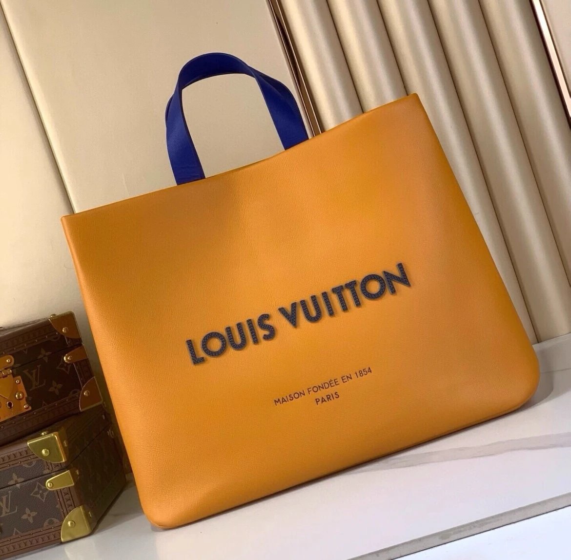 Louis Vuitton Orange Leather Tote Bag with Blue Handles
