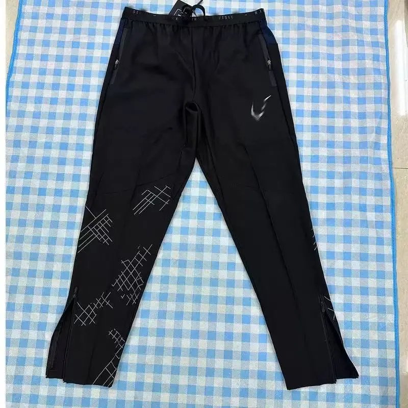 Nike Trousers Lightweight zip-ankle track — Grid nk Black