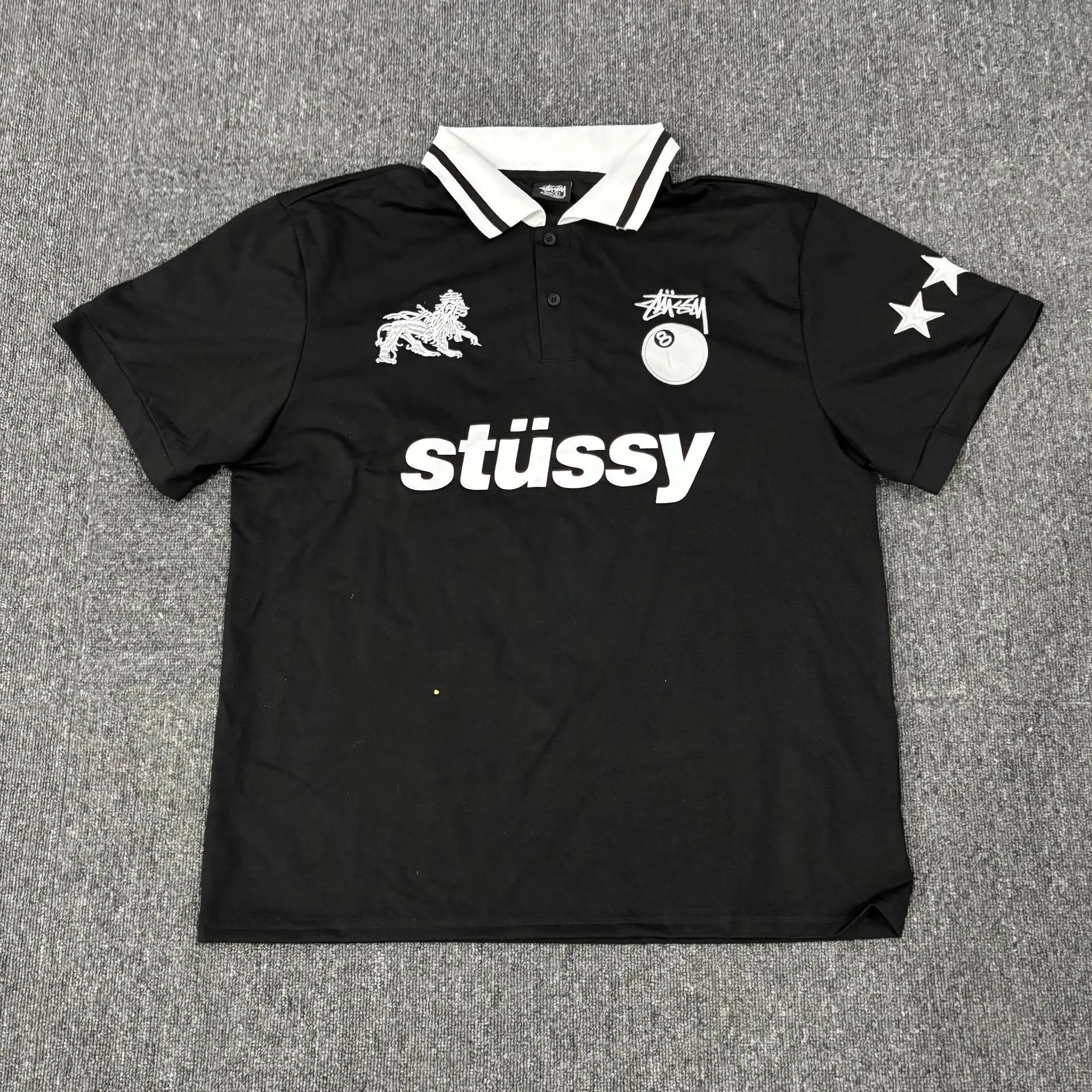 St&uuml;ssy Graphic Polo Shirt with Lion and 8-Ball Motifs