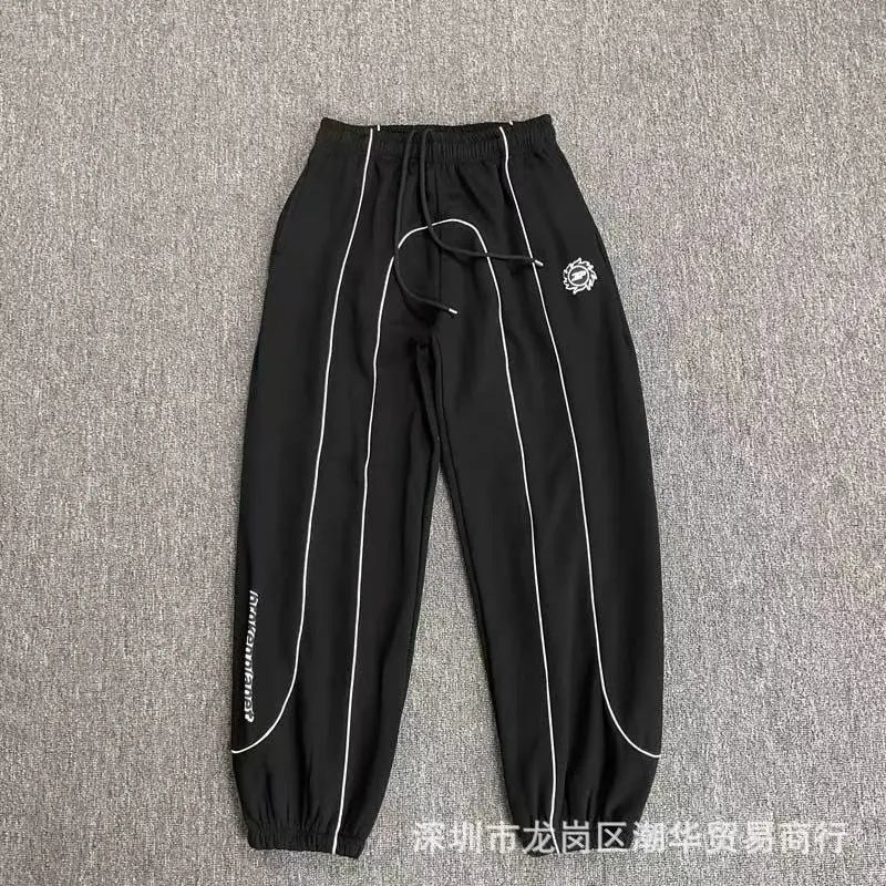 Balenciaga Trousers Wide-leg drawstring sweatpants with side stripes — 28