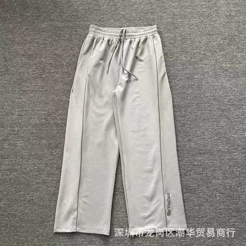 Balenciaga Trousers Wide-leg drawstring sweatpants with side stripes — 9